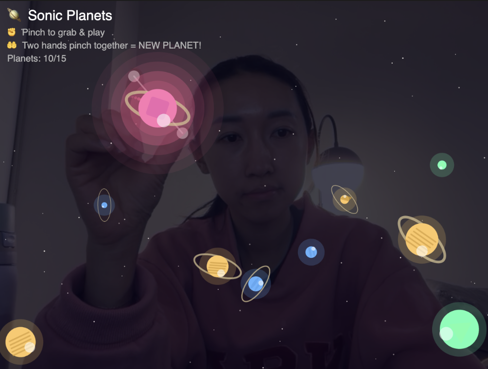 Pinching each planet triggers a different sound.